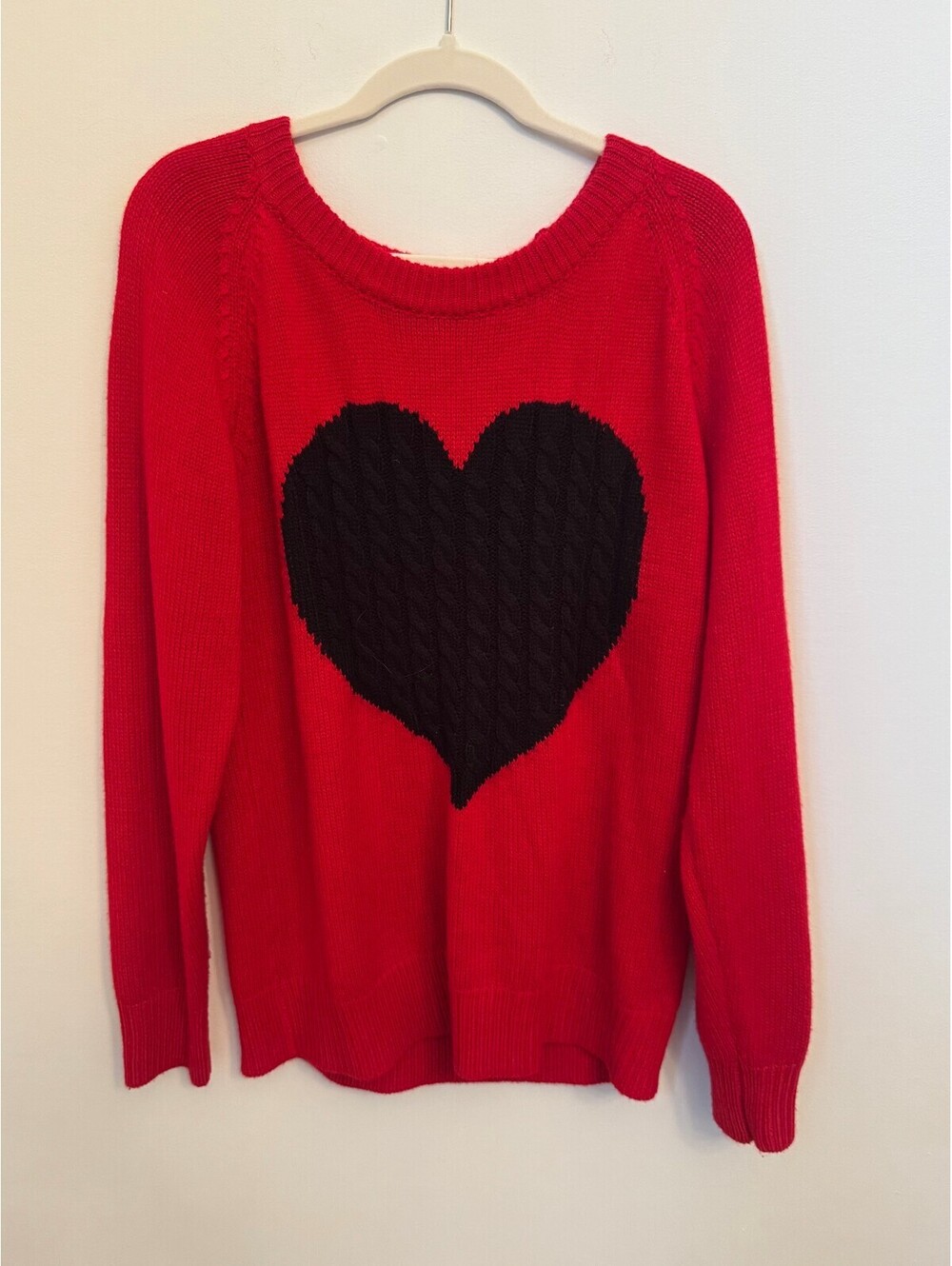 Red sweater with black heart